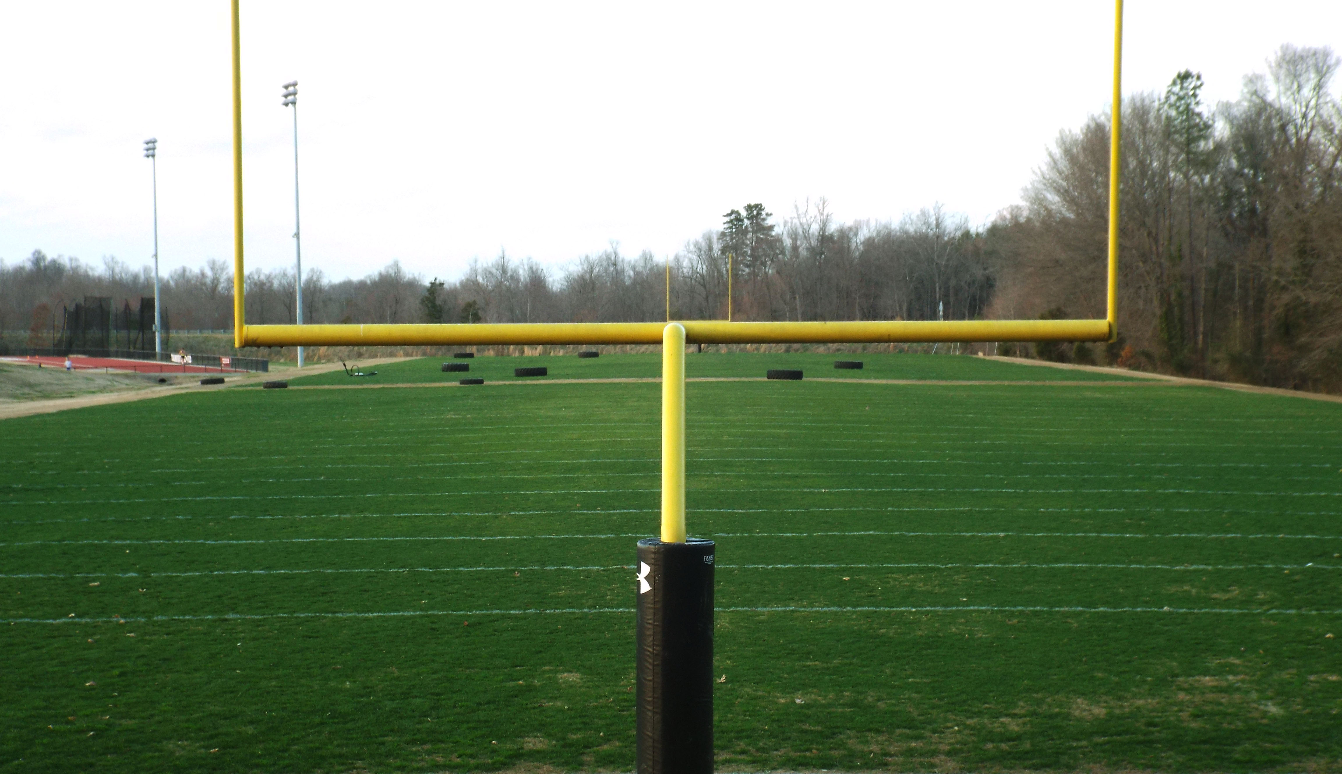 Photo of a football field from a goal post angle